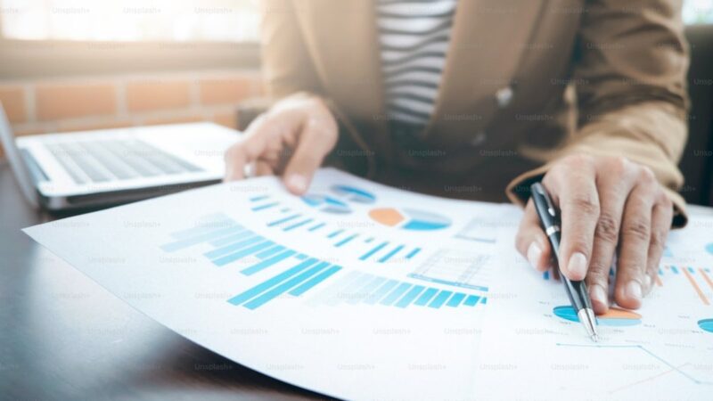 Working business people analyse high performance marketing data.